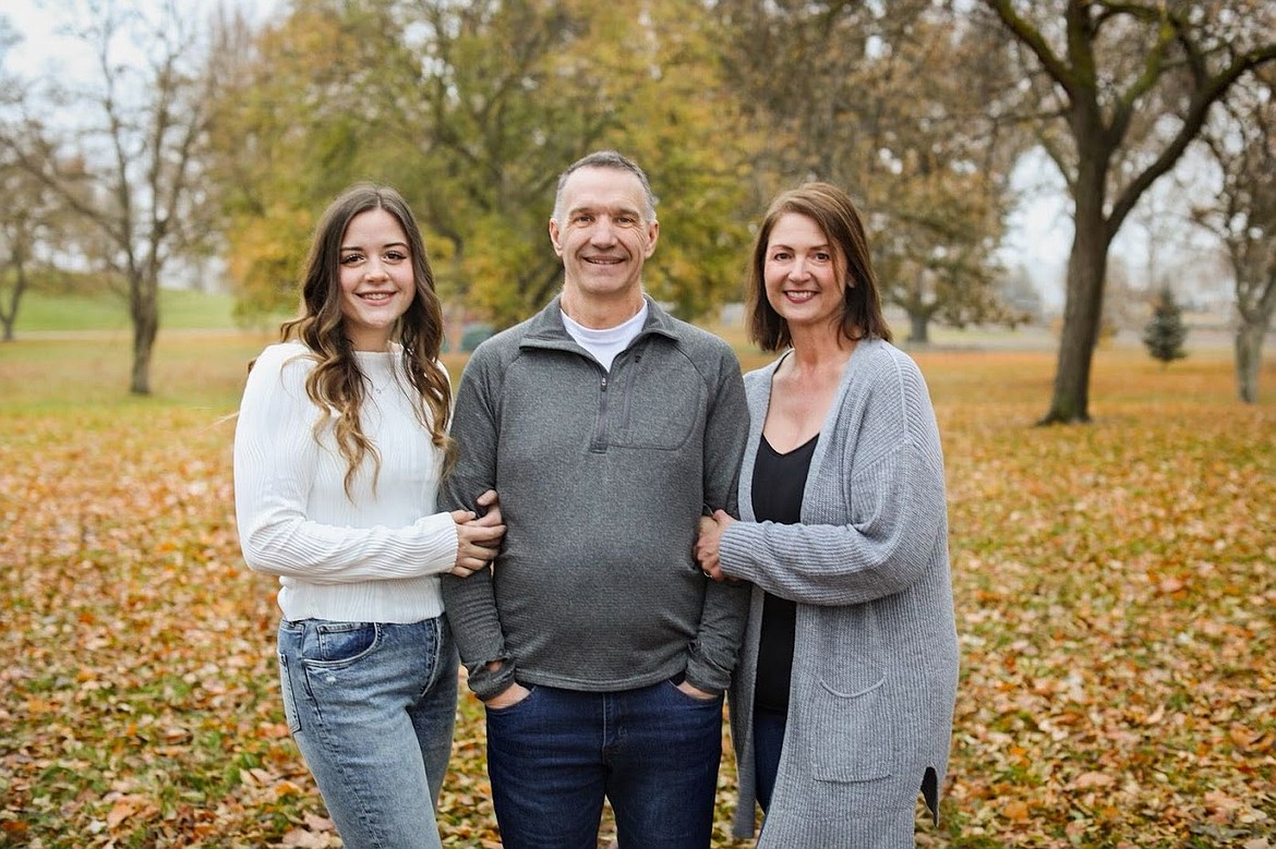 Moses Lake Police Chief Kevin Fuhr pauses for a family photo with his daughter, Jordan Fuhr, left, and wife, Emily Fuhr, right. Fuhr credits his wife and daughter for their efforts to support him as he battles gallbladder cancer and invites the community to join him and the Moses Lake Police Department team for a fundraiser Saturday at 9 a.m. at MLPD.