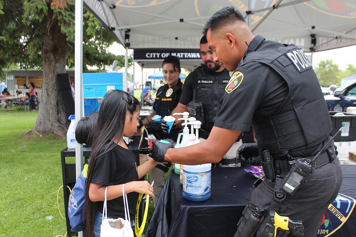 Mattawa Police officers served snow cones during National Night Out, and the popcorn for the movie that followed.