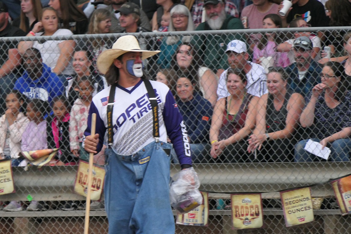 Rodeo clown Dangerous Dave works the capacity crowd during a brief break in the action Saturday night during the Superior Lions Club Rodeo. (Chuck Bandel/VP-MI)