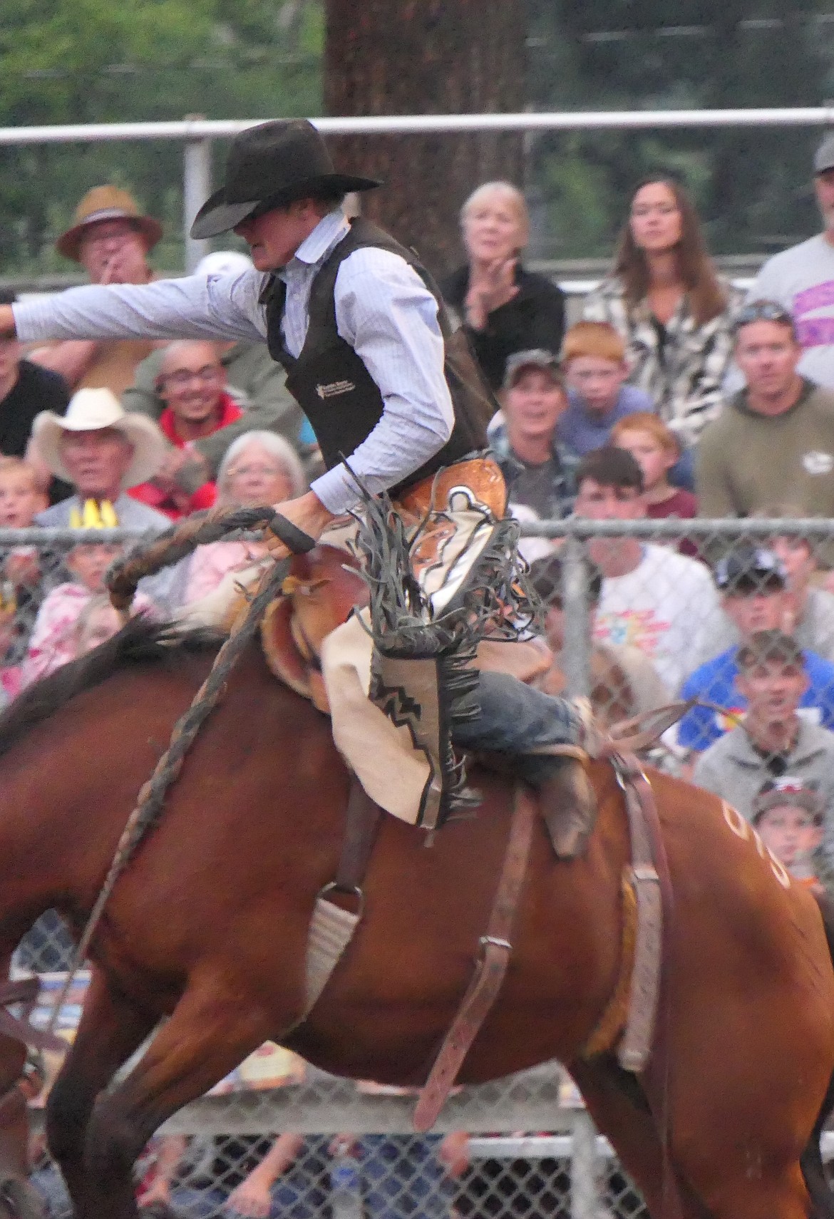 Hometown cowboy Hunter Haskins scored 75 on this ride to win the 2023 Lions Club Rodeo saddle bronc title Saturday night in Superior.  (Chuck Bandel/VP-MI)