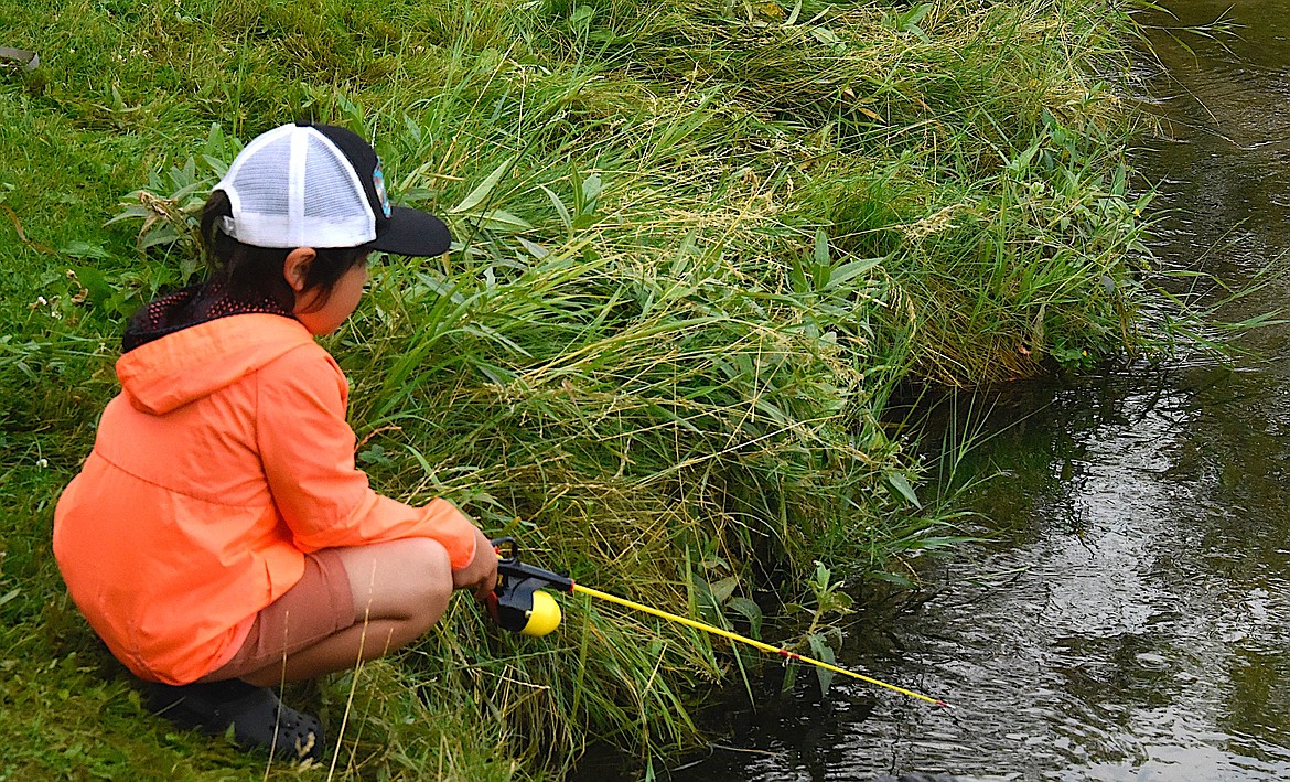 Five-year-old Reegan Fenner fishes in the Pioneer Days Kids Fishing Derby.
(Berl Tiskus/Leader)