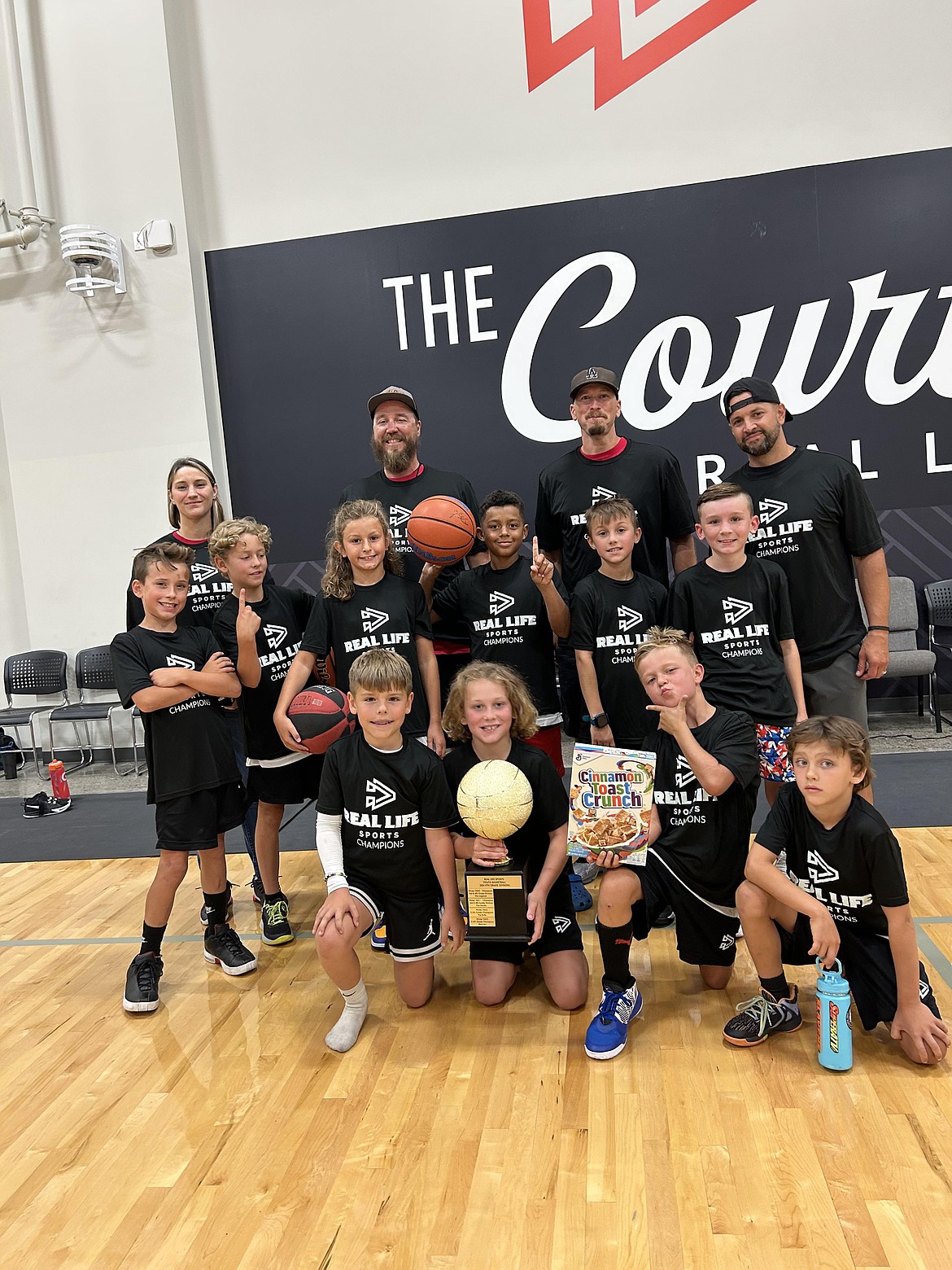 Courtesy photo
Team B. won the third-fourth grade division in the Real Life Competitive Basketball League. In the front row from left are Eli Ferguson, Brody Brennan, Winston Deal and Westin Little; second row from left, Fox Harty, Logan Fredrick, Sullivan O'Dowd, Aure Brennan and Forrest Groff; and back row from left, coach Allison Rittenour, coach Chris Deal, coach Levi Brennan and coach Derek Harty.