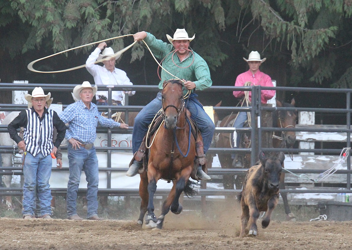 A cowboy gets ready to rope a calf in the tie-down roping competition.