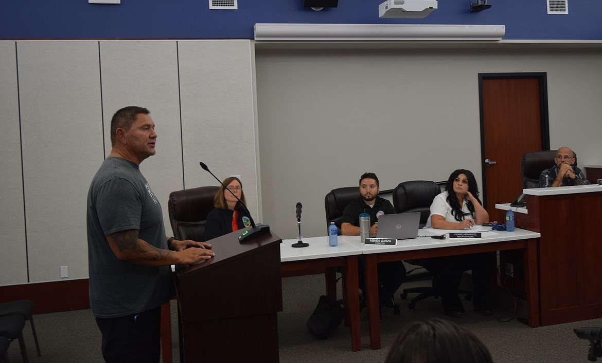 Charles Garcia, left, presents his case for the Othello City Council to waive additional labor fees from the facilities use agreement for him to host the Latino State Championship at Lions Park.