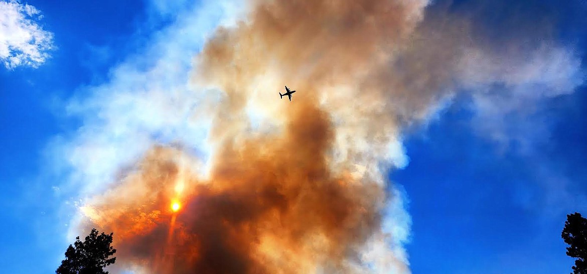 A plane flies over the Gravel Pit Fire Friday, Aug. 4. (Photo courtesy Lincoln County Sheriff's Office Deputy Andrew Smith)