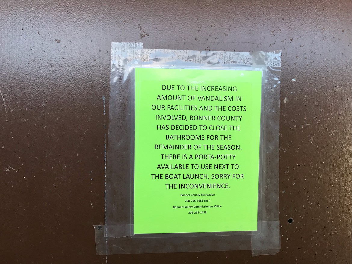 A sign on the bathrooms at Bonner Park West announces their closure due to recent vandalism at the facility.