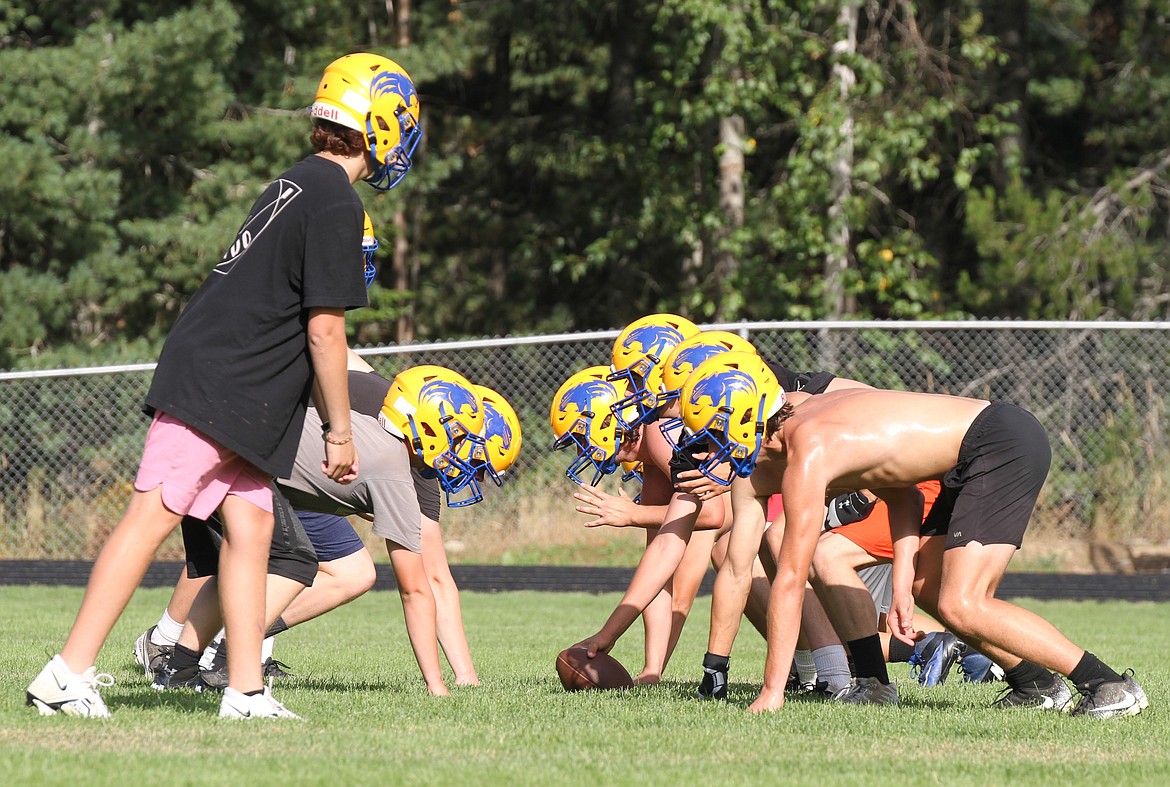 The Clark Fork offensive and defensive line get in position before a snap during the first of two practices on Wednesday.