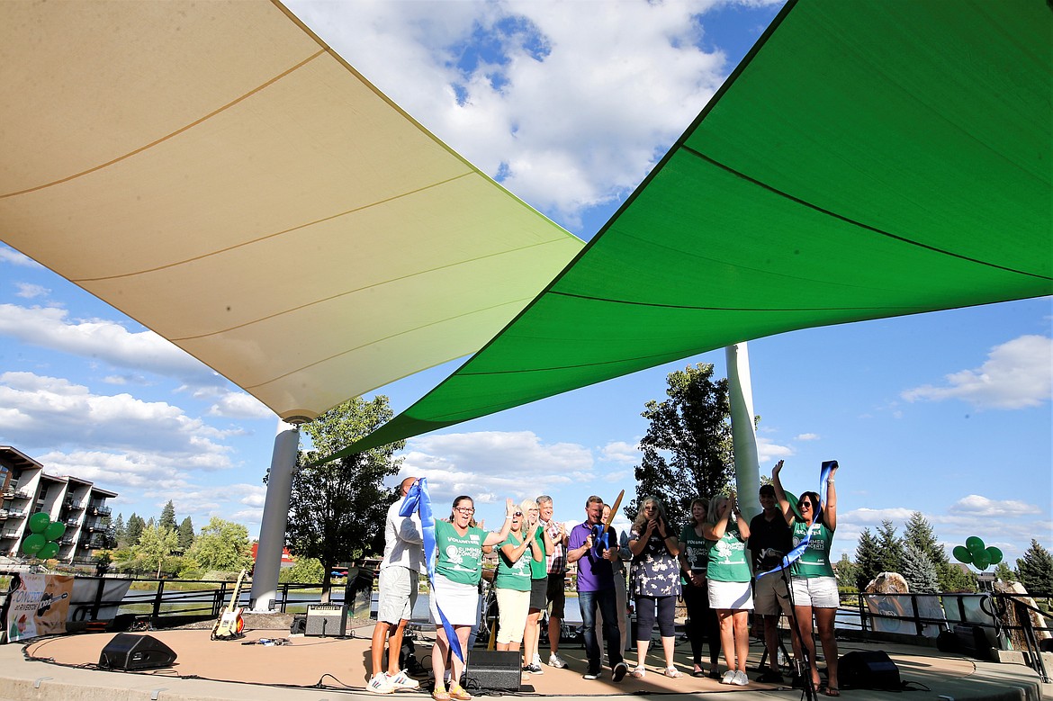 A ribbon-cutting celebrates the new sails over the Riverstone amphitheater before the Riverstone Summer Concert Series on Thursday