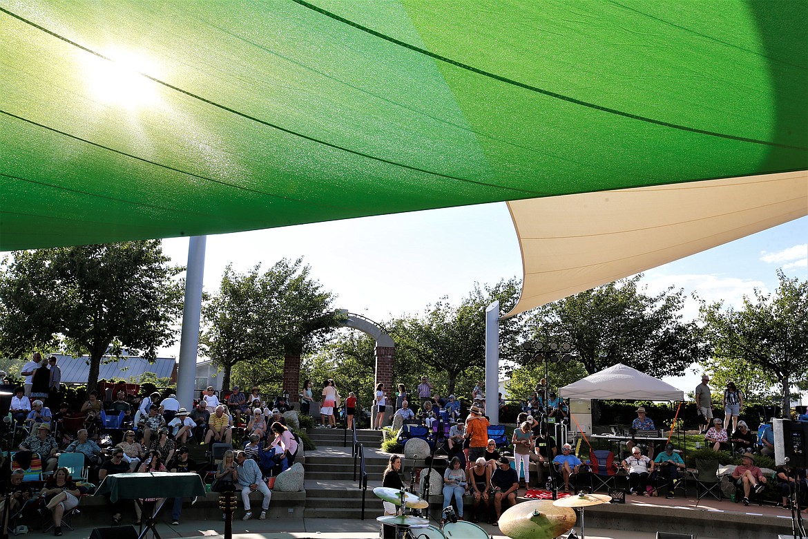 The crowd waits for the Riverstone Summer Concert Series to begin under the new sails that provide shade for the stage on Thursday.