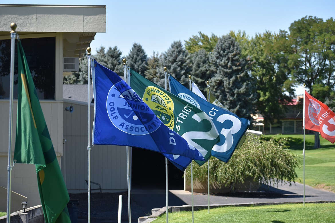 Washington Junior Golf Association district flags fly at the first tee box at the Moses Lake Golf Club. Each of the six districts sends a set amount of golfers to the state tournament, which Moses Lake hosted for the first time this week.