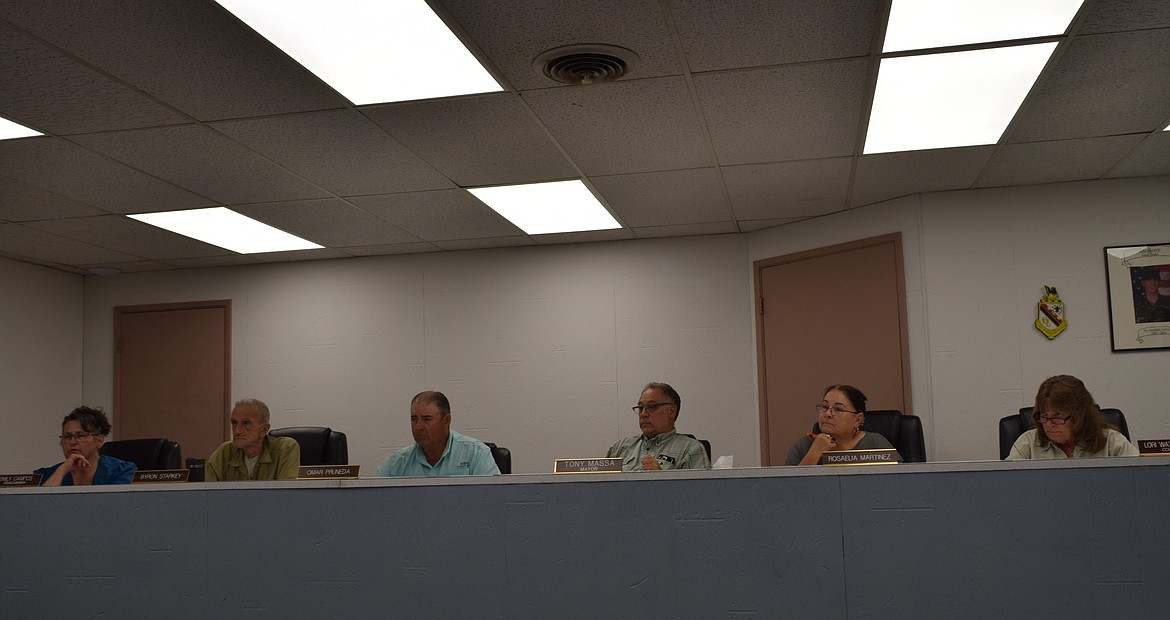 Members of the Warden City Council discuss city business during Tuesday’s meeting, during which the council unanimously approved a motion for the mayor to sign the annexation agreement with the Port of Warden.