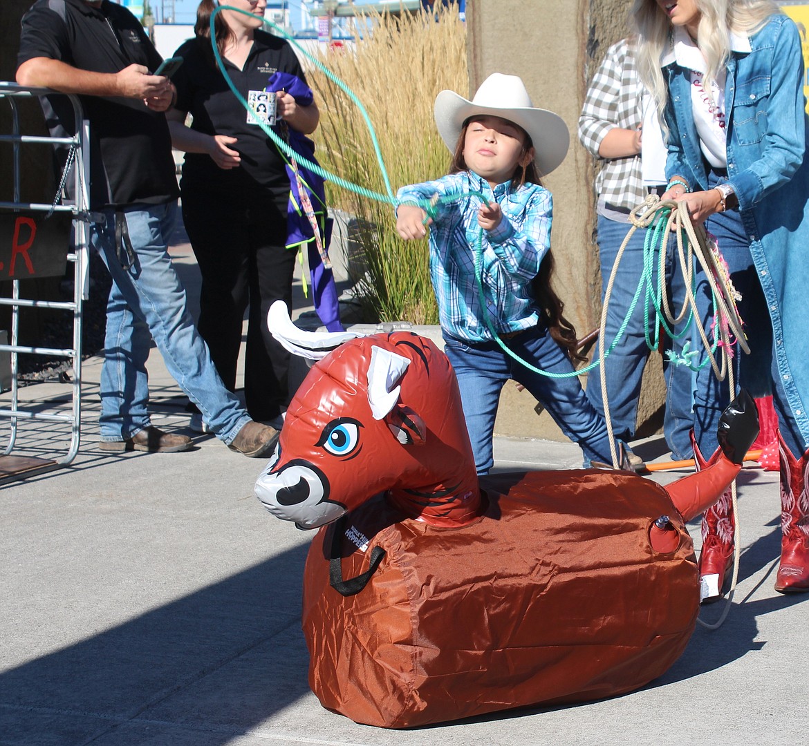 A roping contestant tries her best to take down that steer at the Cowboy Breakfast.