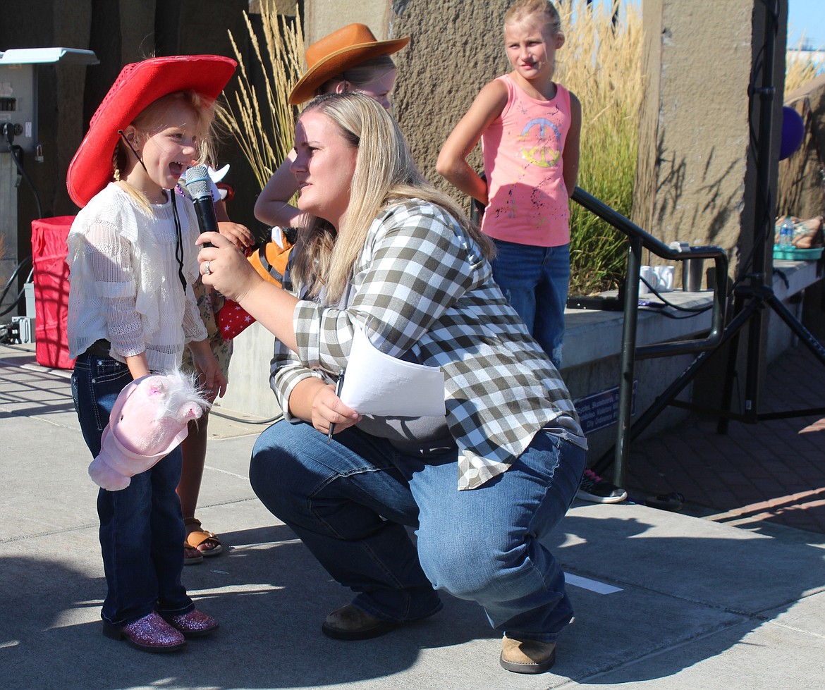 A queen contestant answers a question from Jessica Cox during the Pee Wee Rodeo at the Cowboy Breakfast.