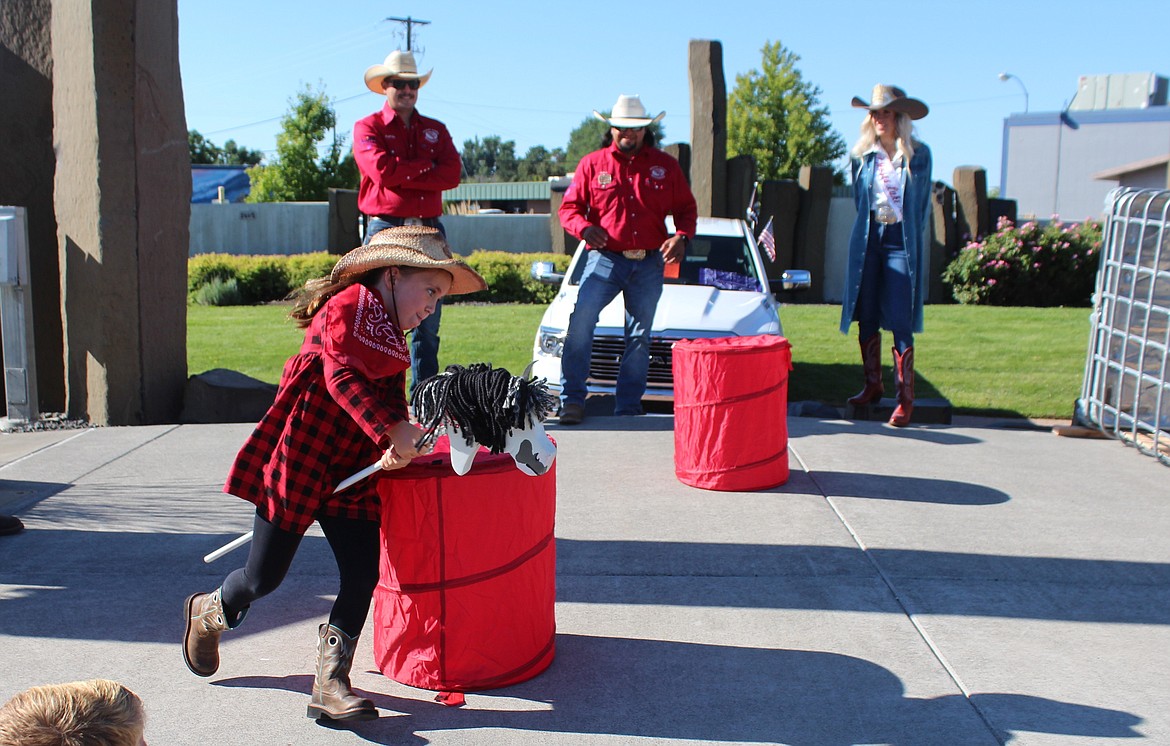 Determined rider and horse round the barrel at the Cowboy Breakfast Friday.
