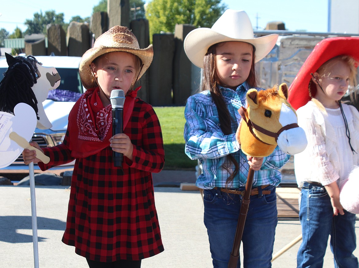 A confident queen contestant answers a question at the Pee Wee Rodeo during the Cowboy Breakfast.