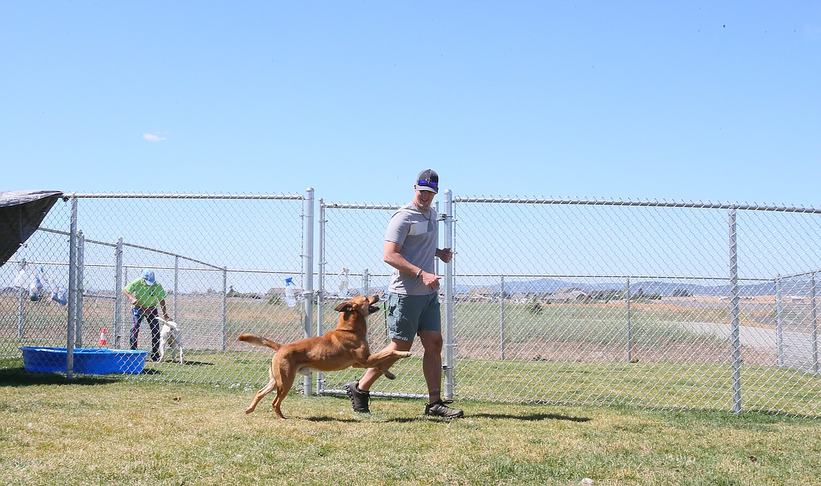 George prances alongside John Huss during a training session Friday.