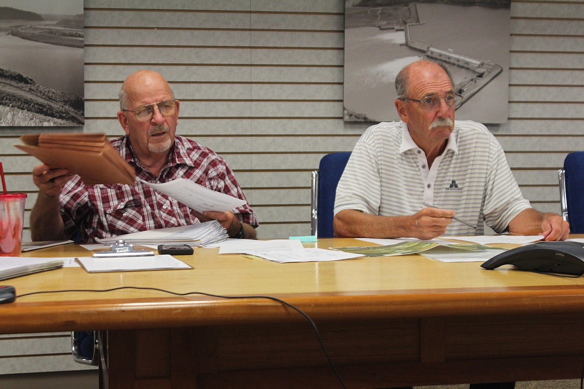 Port of Quincy Commissioners Patric Connelly, left, and Curt Morris, right, discuss the possible sale of the Bishop Recreation Area Wednesday.