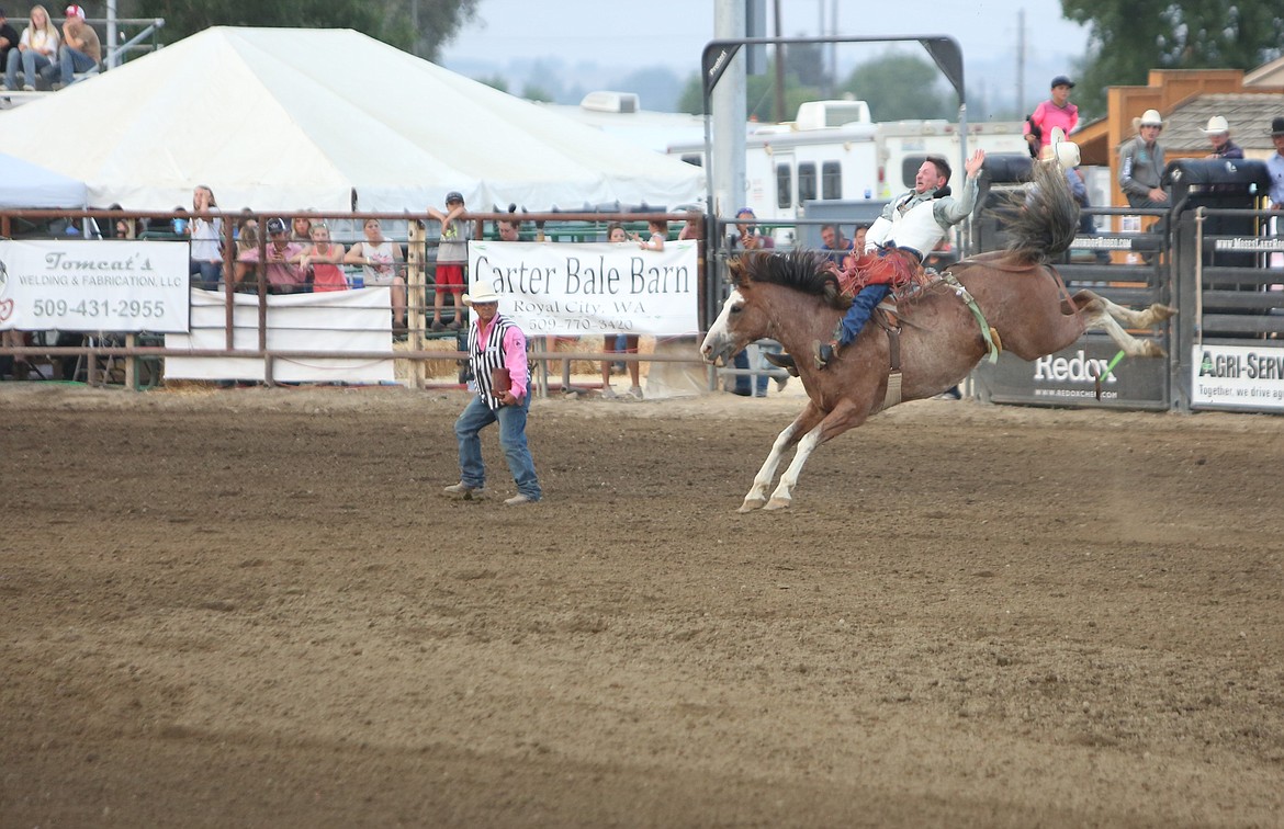 A bareback rider tries to last out his eight seconds at the 2022 Moses Lake Roundup Rodeo. This year’s event, the rodeo’s 80th year, begins Thursday.