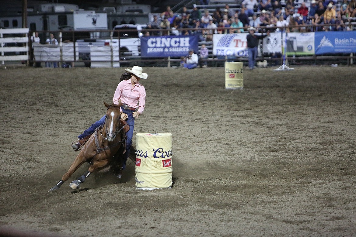 Rodeo organizers expect to see a solid group compete in women's barrel racing during this year's Moses Lake Roundup. Above, a racer navigates the barrels during last year's rodeo.