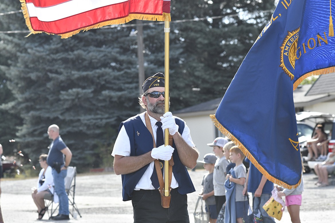 The American Legion Post 149 Color Guard leads the Athol parade, Saturday.