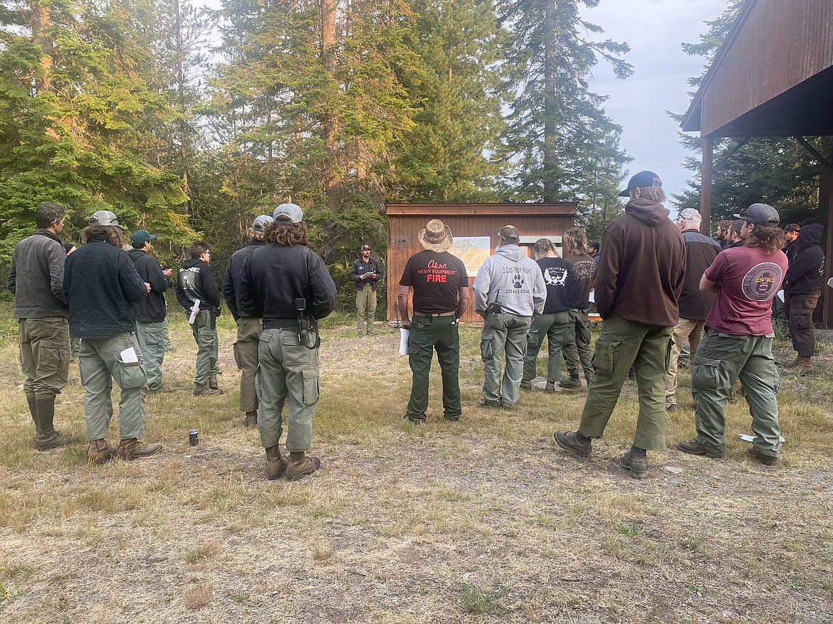 Fire crews gather for a morning briefing on the Buckskin 2 Fire, located about 8 miles south of Clark Fork.