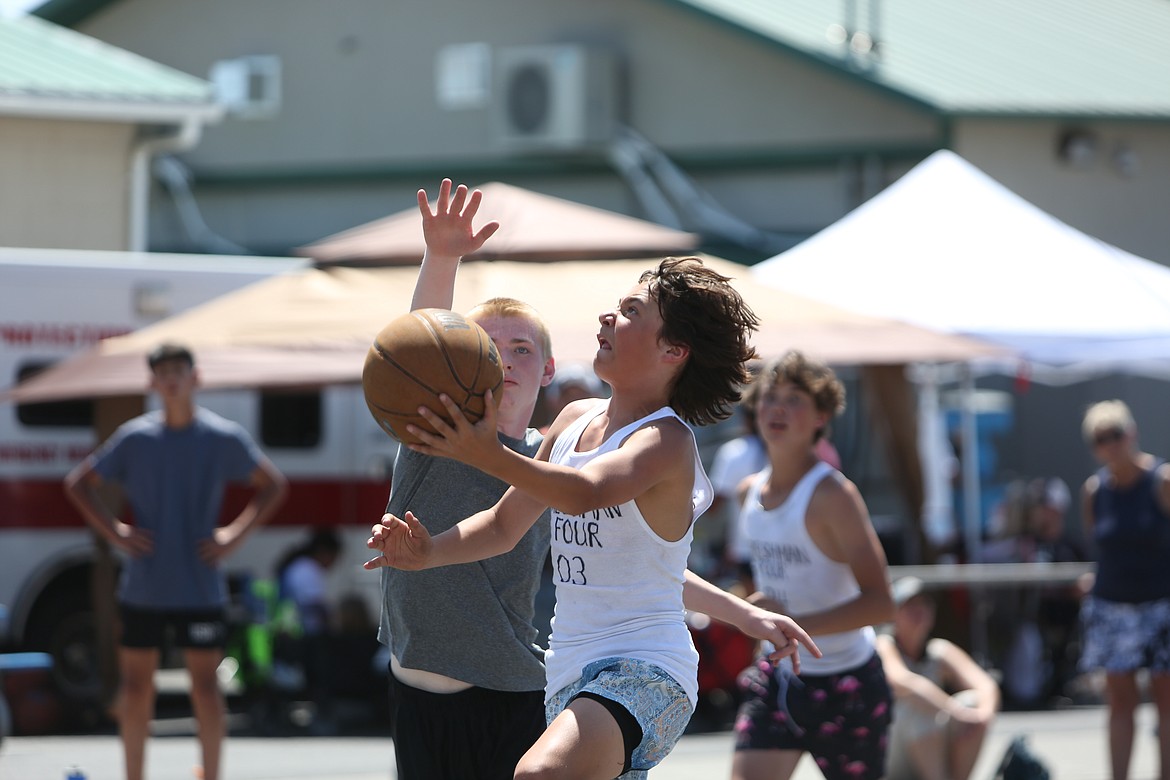 Basketball players of all ages took to the streets of Quincy for the Dru Gimlin 3-on-3 tournament in June, where nearly 100 teams played on 16 outdoor courts.