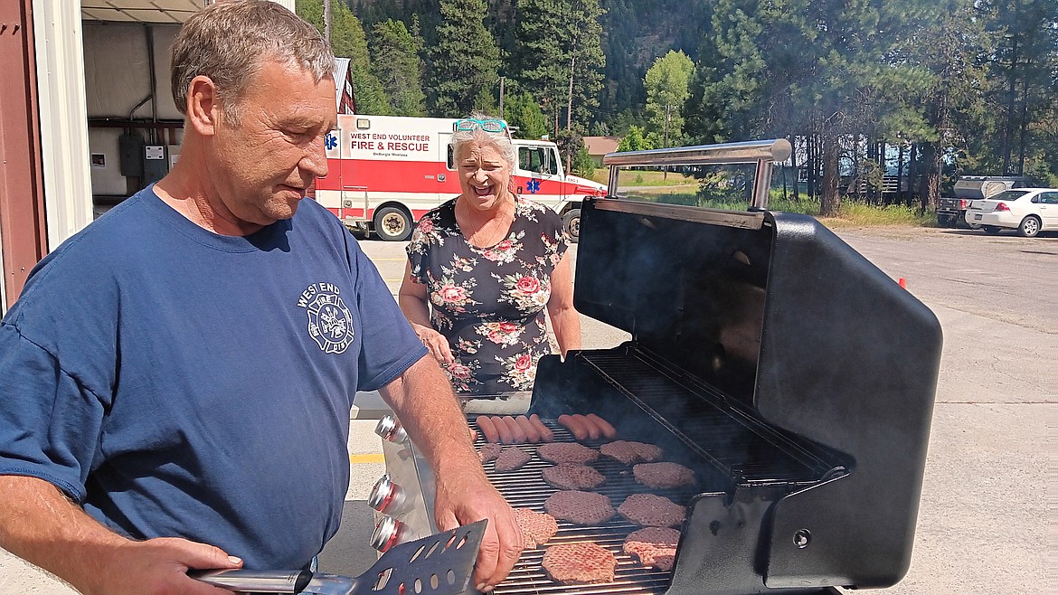 West End Volunteer Fire Department Chief, Frank Magee and his wife, Louise, served around 60 hotdogs and over 80 hamburgers Saturday at the fire department. An open house was held for recruiting purposes but also as a community gathering. This was the first year a car show was added to this annual event. (Monte Turner/Mineral Independent)