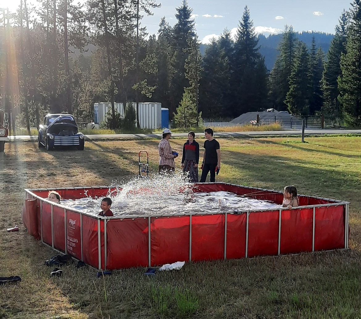 The Belzak family were thrilled to take a dip in the drop tank which is used on a fire scene as a reservoir for trucks to siphon water to continue fighting the fire. WEVFD Chief, Frank Magee, said he considers the Belzak kids as his future fire fighters as it’s a large family.