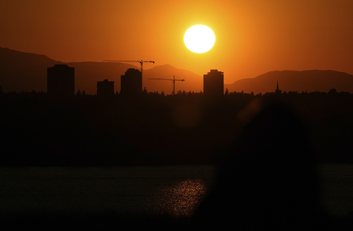 The sun sets over the University District in Seattle in May. A hazardous heat wave is expected to bring scorching temperatures to the Pacific Northwest this week, according to the National Weather Service, increasing the risk of wildfire.