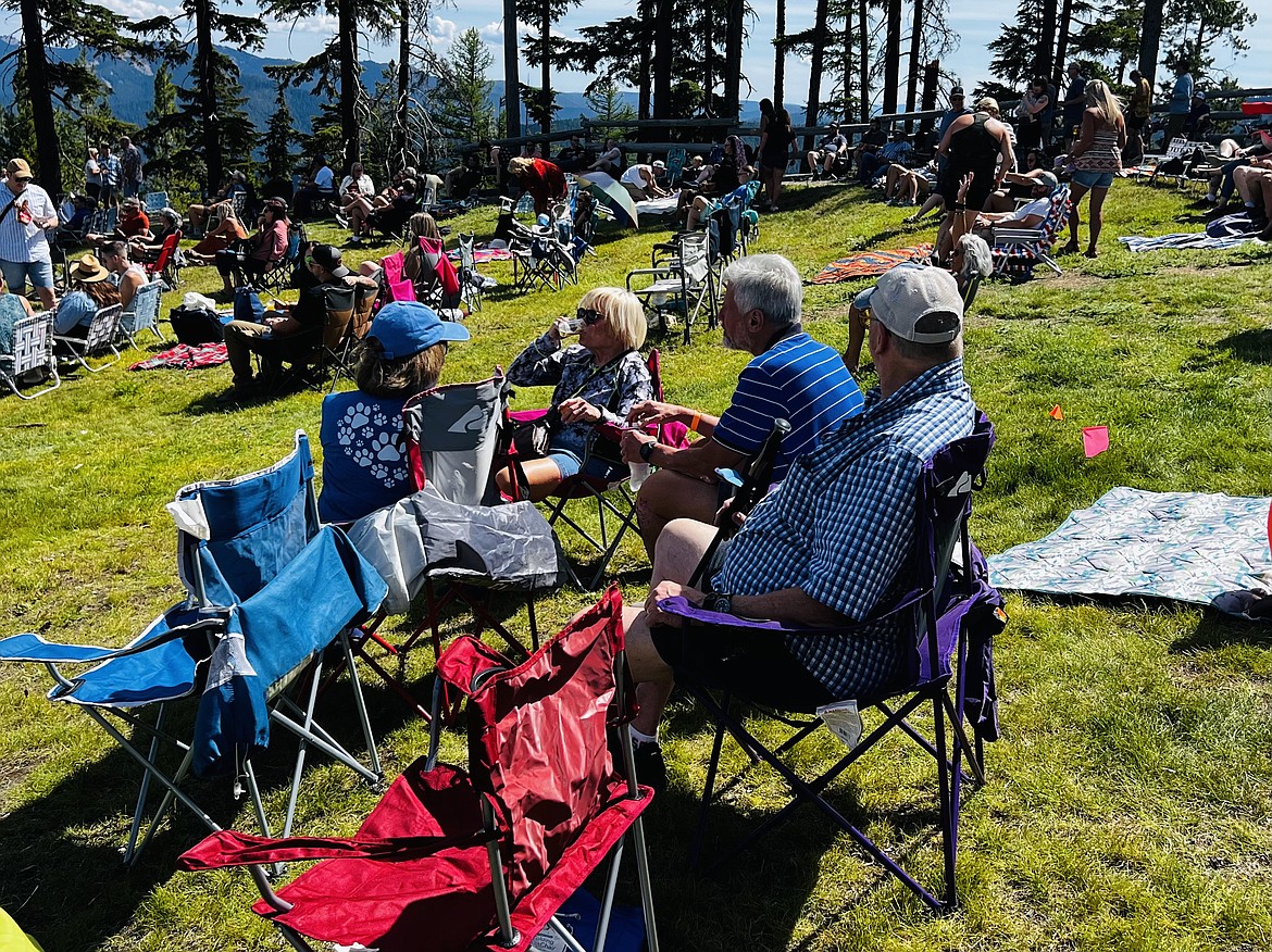 A group of people enjoy some beer and the live music during Brewsfest on Silver Mountain.