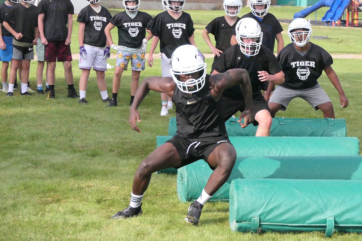 Senior running back/kick returner Kofi Appiah, works on the agility bags during pre-season workouts last week in St. Regis.  (Chuck Bandel/MI-VP)