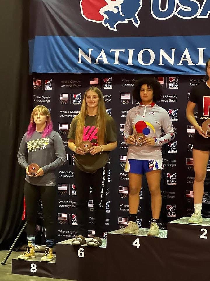 Moses Lake sophomore Reese Prescott (6) stands on the podium after placing sixth at the USA Wrestling 16U National Championships in Fargo, North Dakota.