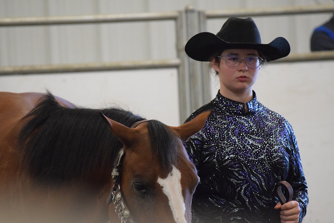 One of the competitors waits for judging to finish in the heat ahead of hers. Competitors generally carried themselves with grace as they worked with their horses.