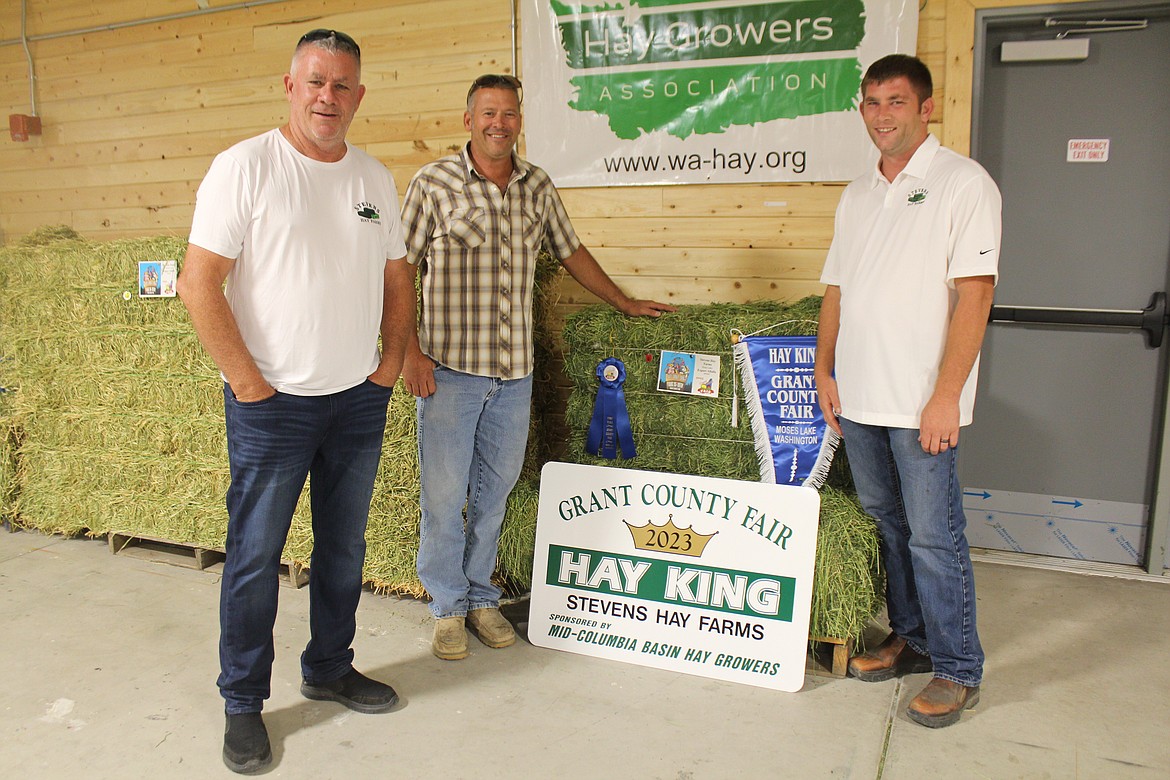 From left, Bill Stevens of Stevens Hay Farms, Stevens Hay CEO Jason Gunderson and Kye Stevens with the farm’s award-winning hay.