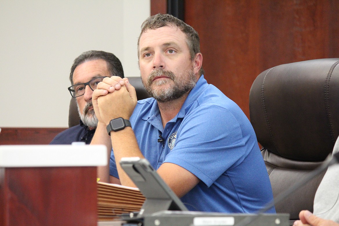 Jon Erickson listens to a presentation to the Othello City Council Monday. Erickson resigned from the council during the meeting, indicating that he had moved outside of the city and was no longer eligible to remain on the council as a result.