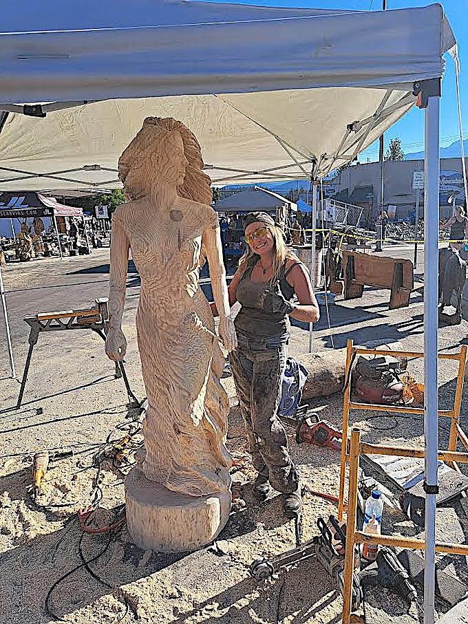 Marina Cole shows off her carving that earned first place honors at the 2022 Kootenai Country Montana International Chainsaw Carving Championship. (Courtesy photo)