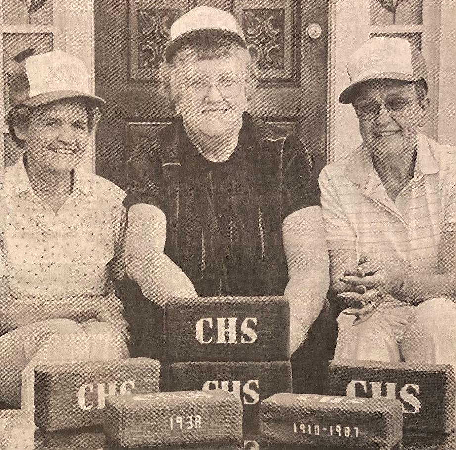 For their 50th CHS reunion in 1988, Class of 1938 alumni (from left) Marge Wilson Kristin, Peggy Ferguson Kelly and Maxine Barnes Nelson handed out souvenir bricks from the old high school.