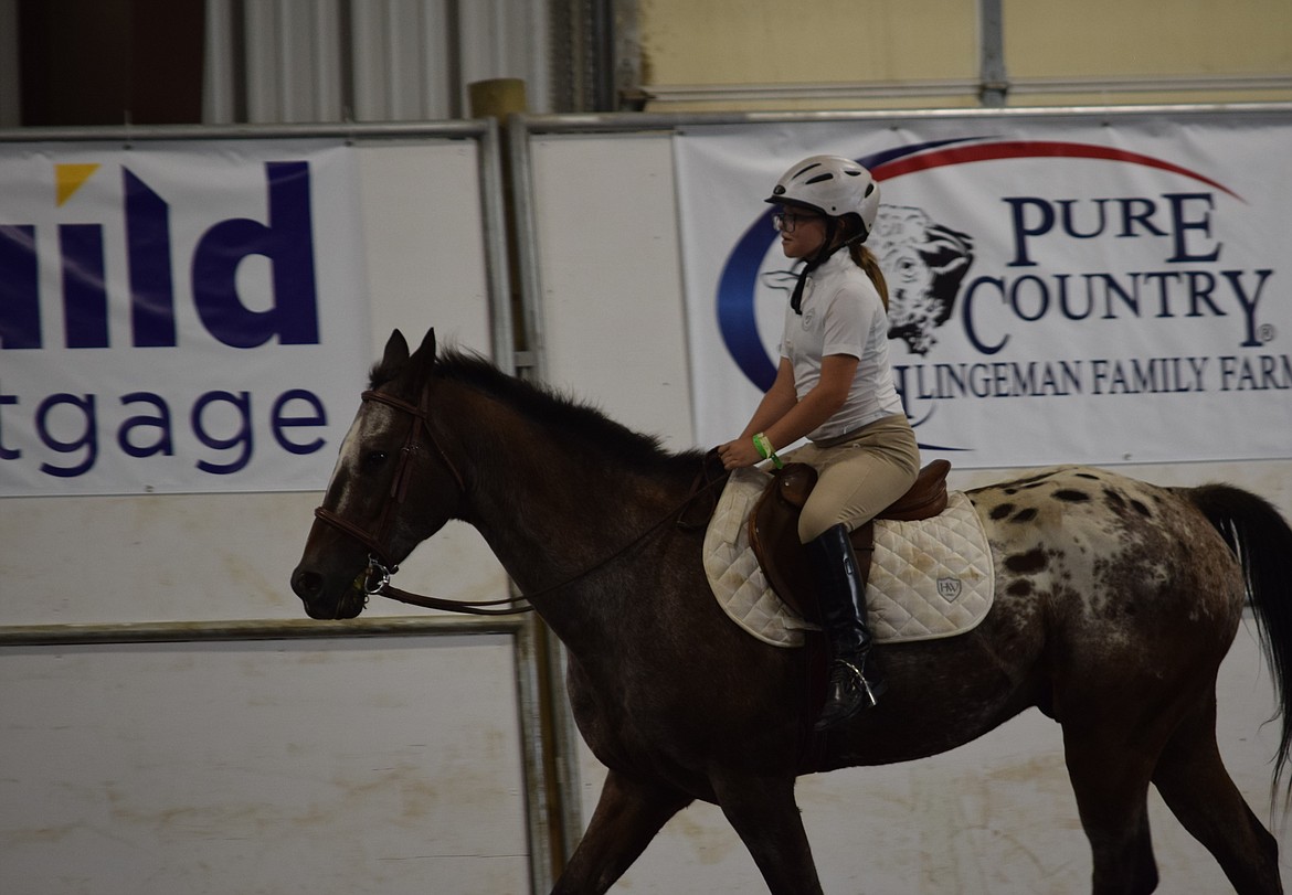 A novice competitor goes through the course to be judged during the English Equitation competition at the 2023 Grant County Fair. This is the fair’s 80th year and dozens of competitions related to horses, cattle, sheep and other animals will see area enthusiasts competing.