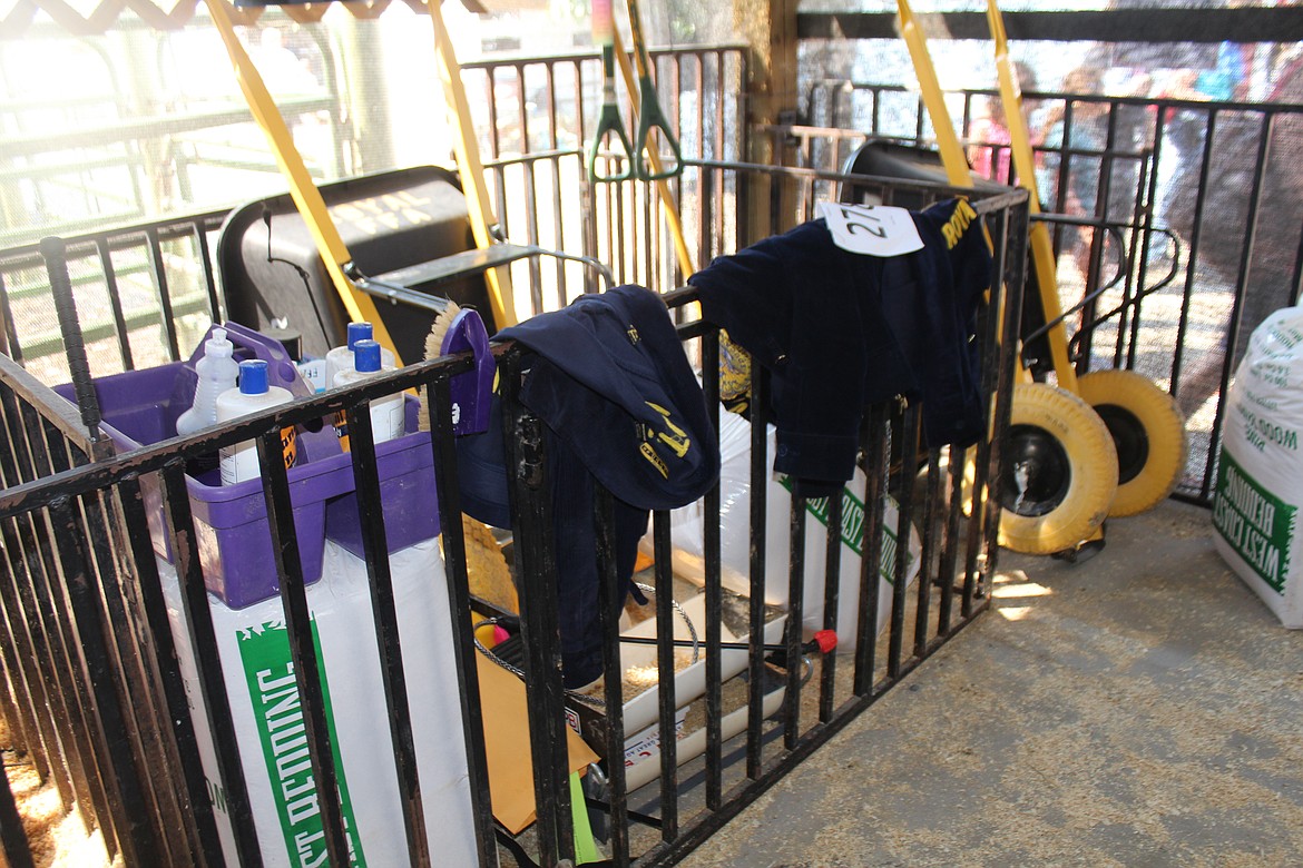 Competition over on a hot day, the FFA jacket is the first thing to go. Jackets hang on a fence in the swine barn.