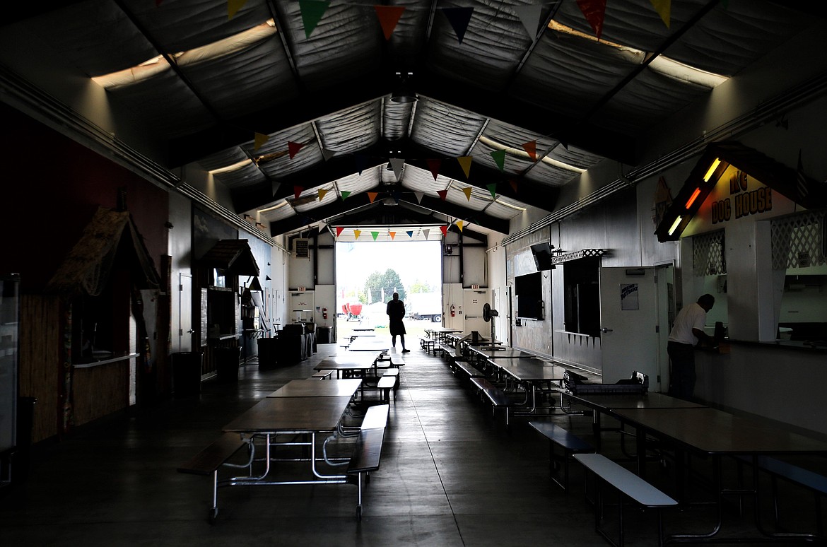 People prepare for the North Idaho State Fair in the Food Court on Wednesday.