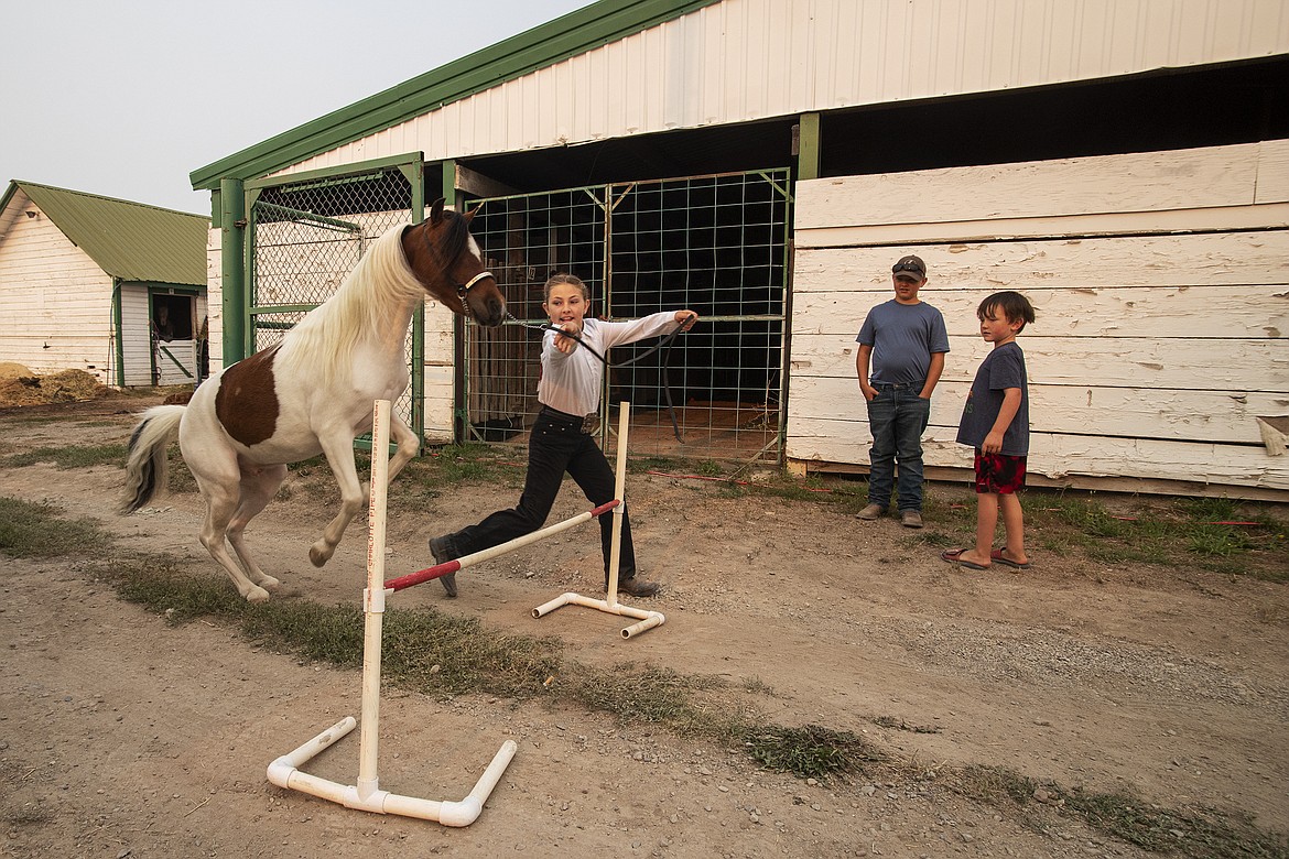 Sidni Sorensen practices a jump before the show at Flathead County Fairgrounds on Thursday, Aug. 17. (Avery Howe/Hungry Horse News)