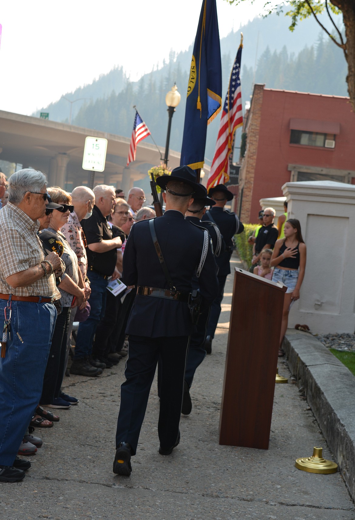 Members of the Idaho State Police color guard take away the flags after the dedication of a memorial to two fallen police officers in Shoshone County Thursday morning.