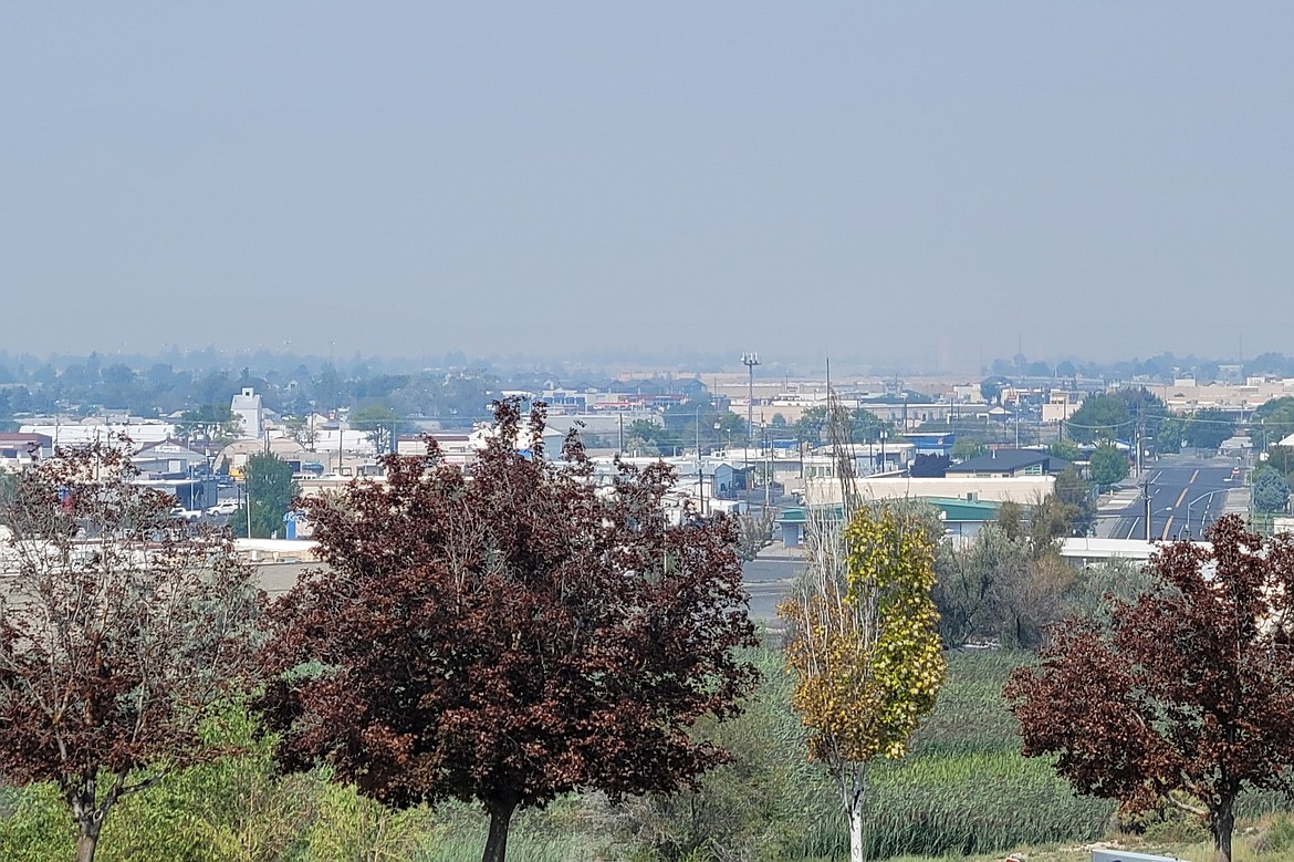 Smoke from a wildfire fills the air in this photo taken from the parking lot at Samaritan Hospital in Moses Lake. The Grant County Health District is warning residents that ongoing fires in Washingotn and British Columbia could affect air quality in the region and urging them to take precautions to manage any breathing problems that may come up.