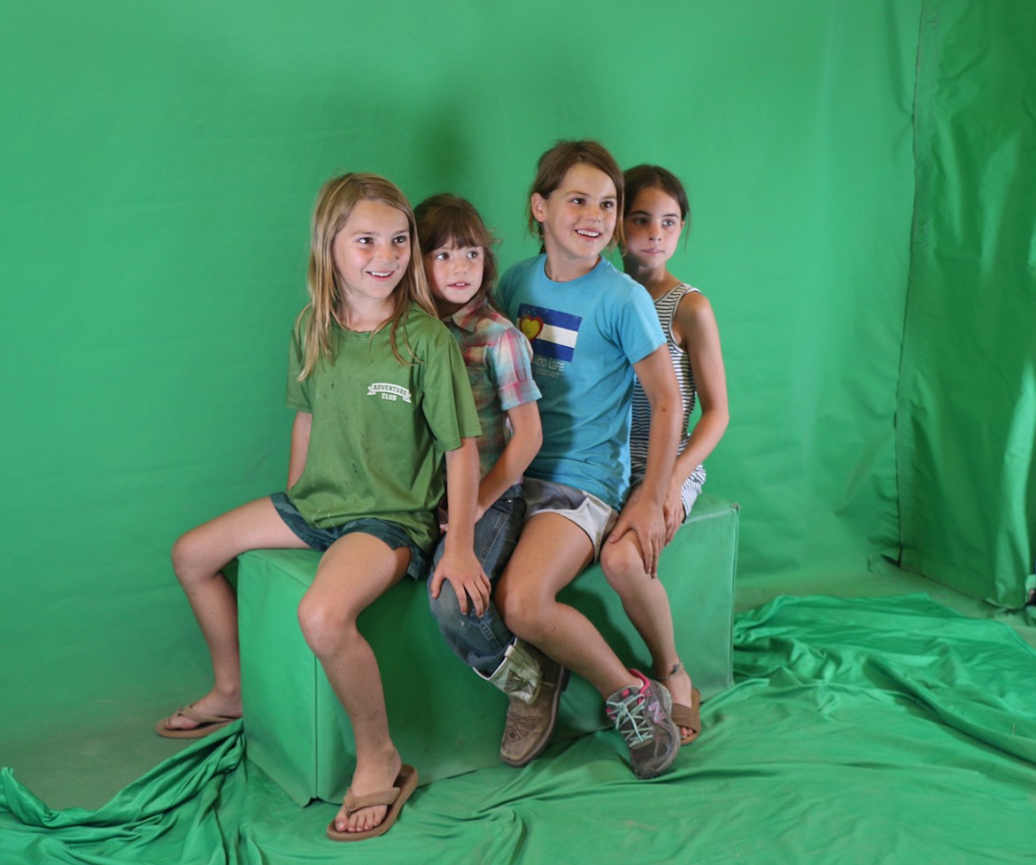 A young quartet get ready to have their photos taken at the World's Funniest Photo Booth on Thursday. The booth is just one of many great things to do and see at the Bonner County Fair, which continues through Saturday.