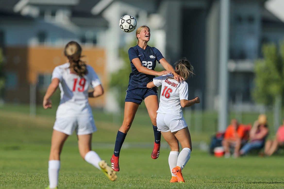 JASON DUCHOW PHOTOGRAPHY
Freshman Ella Pearson of Lake City rises for a header as senior Aliya Strock of Sandpoint defends in the season opener for both teams Friday at the Irma Anderl Soccer Complex at Lake City High. Sandpoint won 1-0.