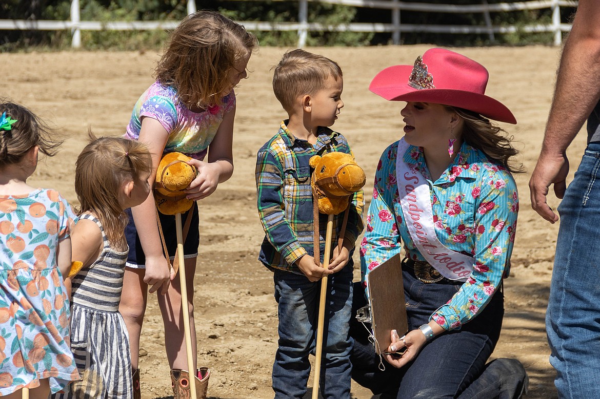 A participant in the World's Smallest Rodeo talks to Bonner County Fair royalty during Friday's event.