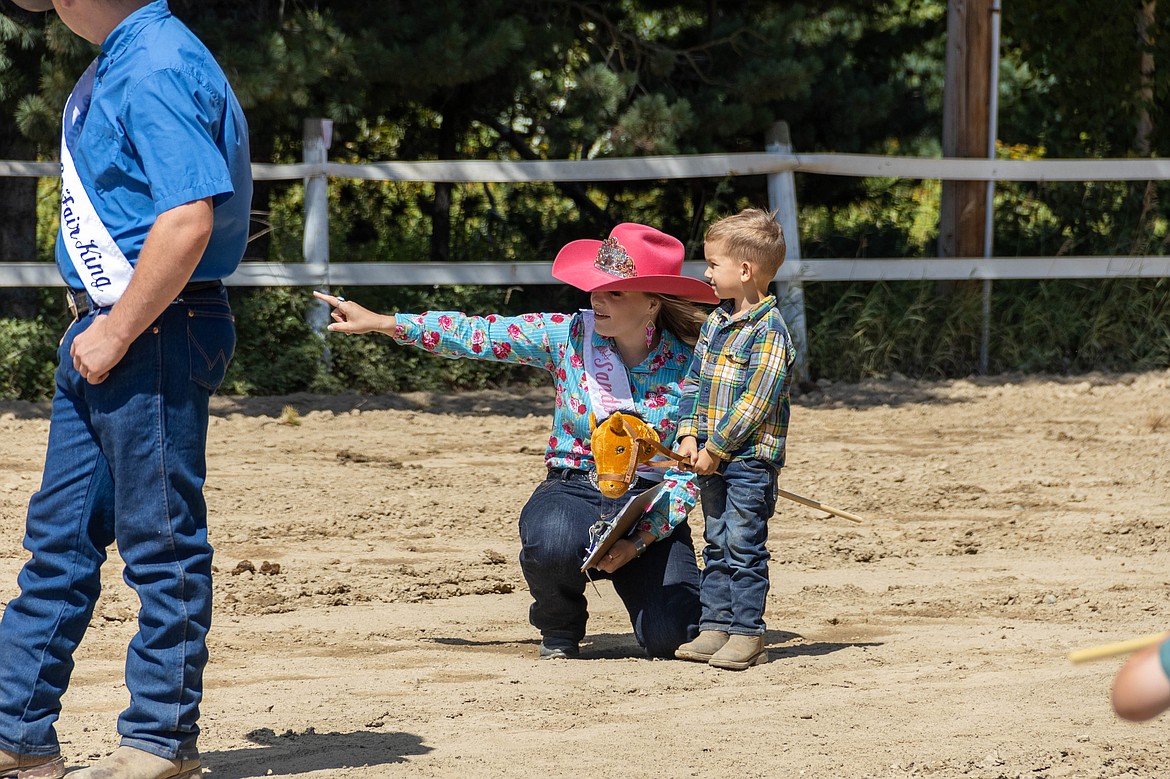 A participant in the World's Smallest Rodeo talks to Bonner County Fair royalty at the Bonner County Fair on Friday.