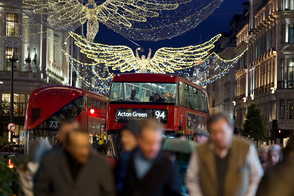 FILE - Christmas lights are displayed on Regent Street in London on Nov. 24, 2022. The rate of inflation in the U.K. fell sharply in July to a 17-month low largely on the back of lower energy prices, official figures showed Wednesday, Aug. 16, 2023, a welcome development for hard-pressed households struggling during the cost of living crisis. (AP Photo/Kin Cheung, File)