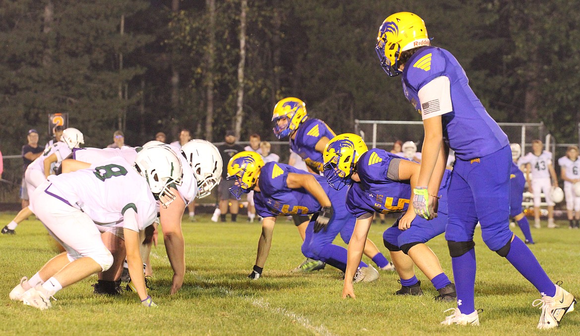 Mullan/St. Regis and Clark Fork get set on the line before a play during the second half on Friday.