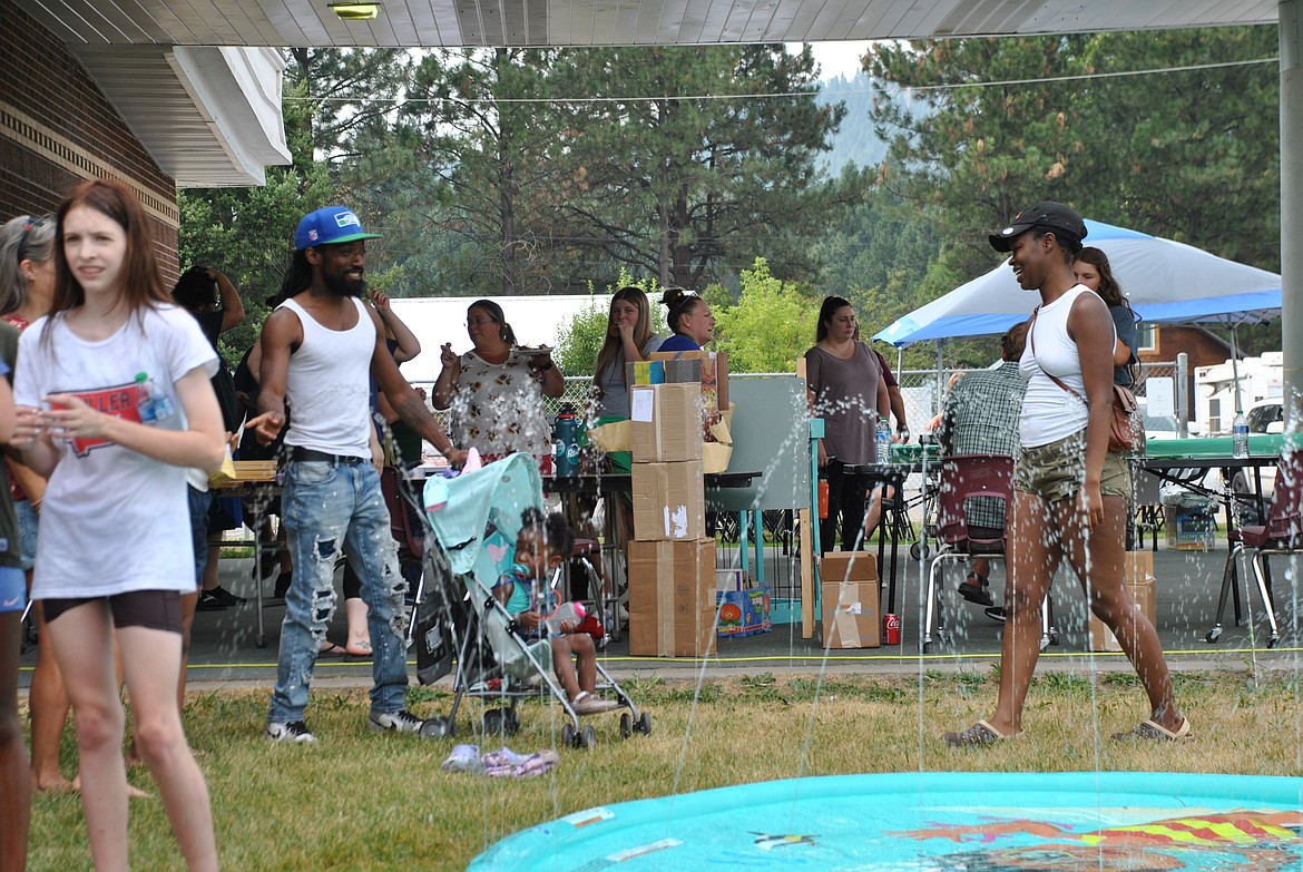 St. Regis Schools held their 4th annual Back to School Bash on August 17, for staff, students, parents, and community members. In the heat of the late summer afternoon, kids played in bounce houses, splashed down water slides, and traversed obstacle courses, while new teachers and parents mingled, gave presentations, and ate dinner prepared by the cafeteria staff. The first day of school for St. Regis students is Monday, August 21. (Mineral Independent/Amy Quinlivan)